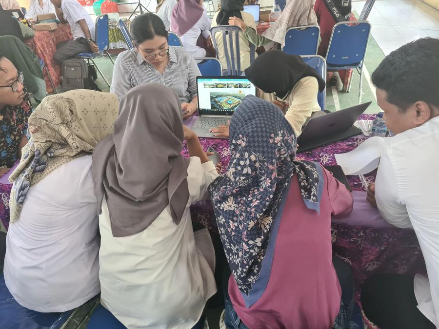 People around a table with computers