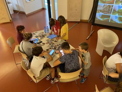 Childrens working on tablets and computer