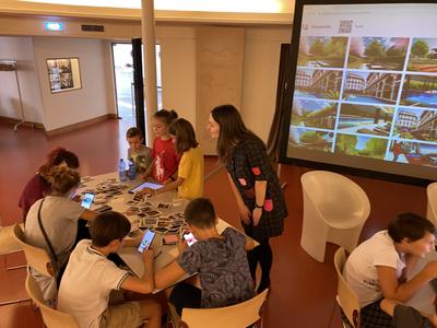 Childrens working on tablets and computer
