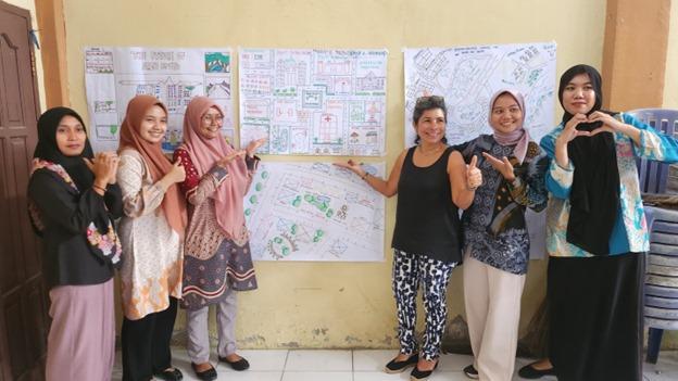 6 people showing posters