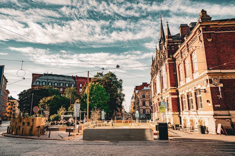 The built Helsinki summer street with parklets and greenery, June 2023