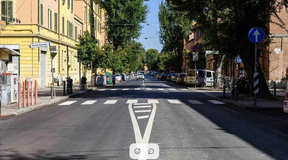 Via Sante Vincenzi, Bologna, as found: plain asphalt and parked cars