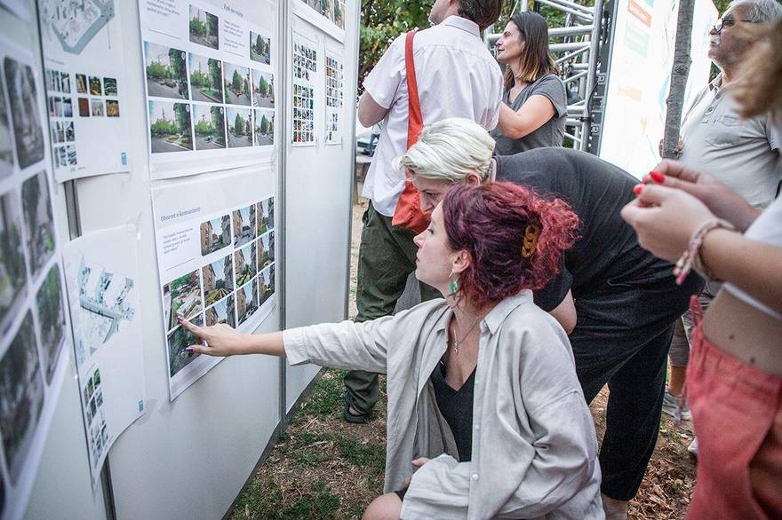 Residents reviewing design boards at the Blloku workshop in Pristina