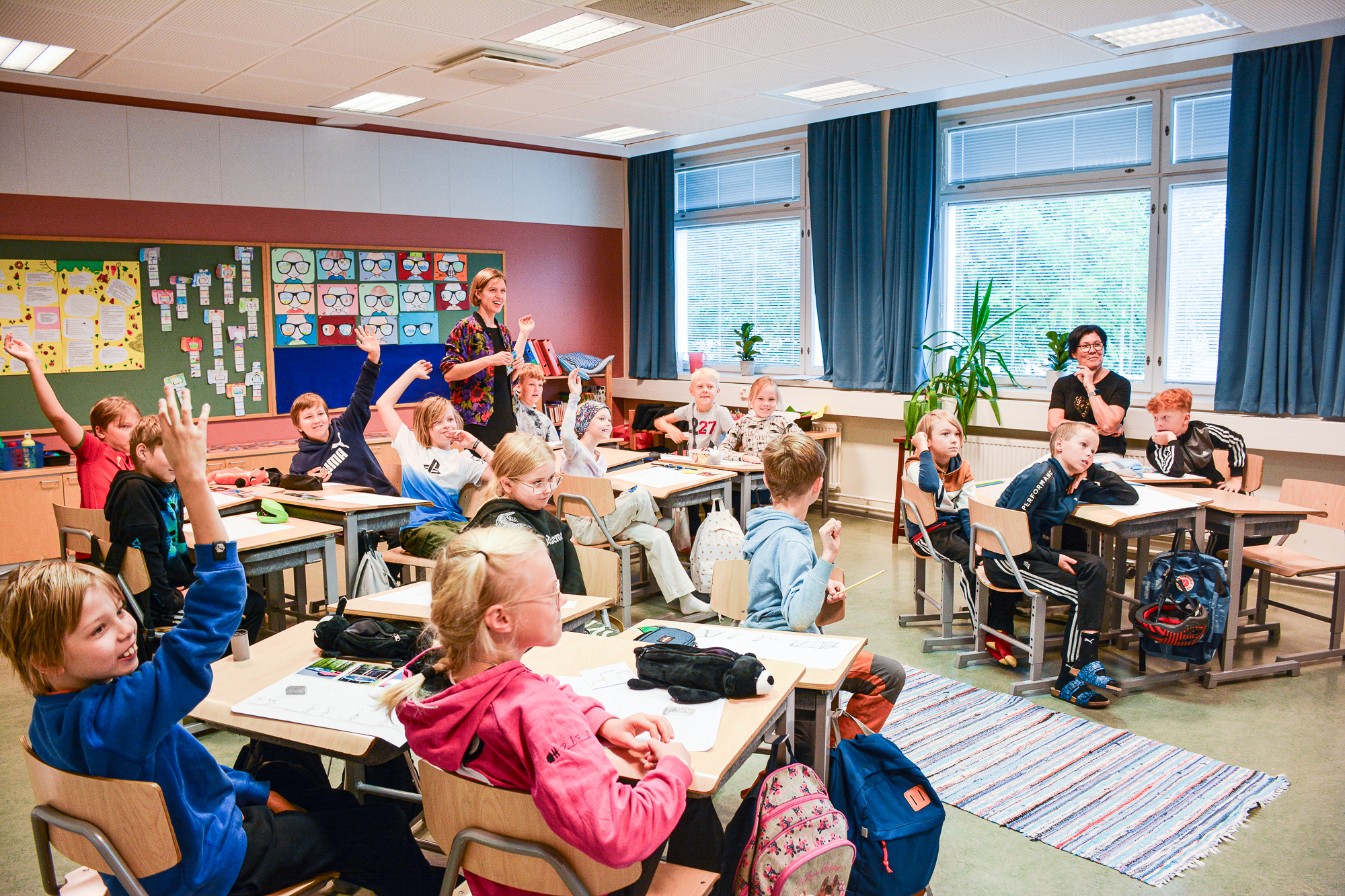 Children redesigning their schoolyard on tablets